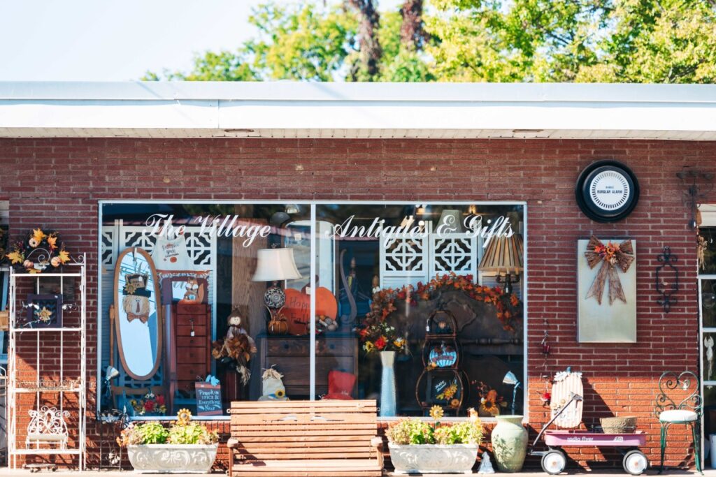 7 Antique & Vintage Shops with the Best Finds in Franklin A charming antique shop with a rustic wooden bench and colorful fall decorations outside in Williamson County, Tennessee.