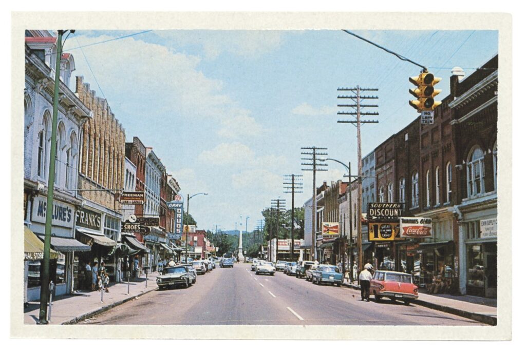 Franklin Then & Now: 15 Must-See Spots Full of History Vintage American downtown street scene with classic cars, shops, and traffic lights in Williamson County, Tennessee.