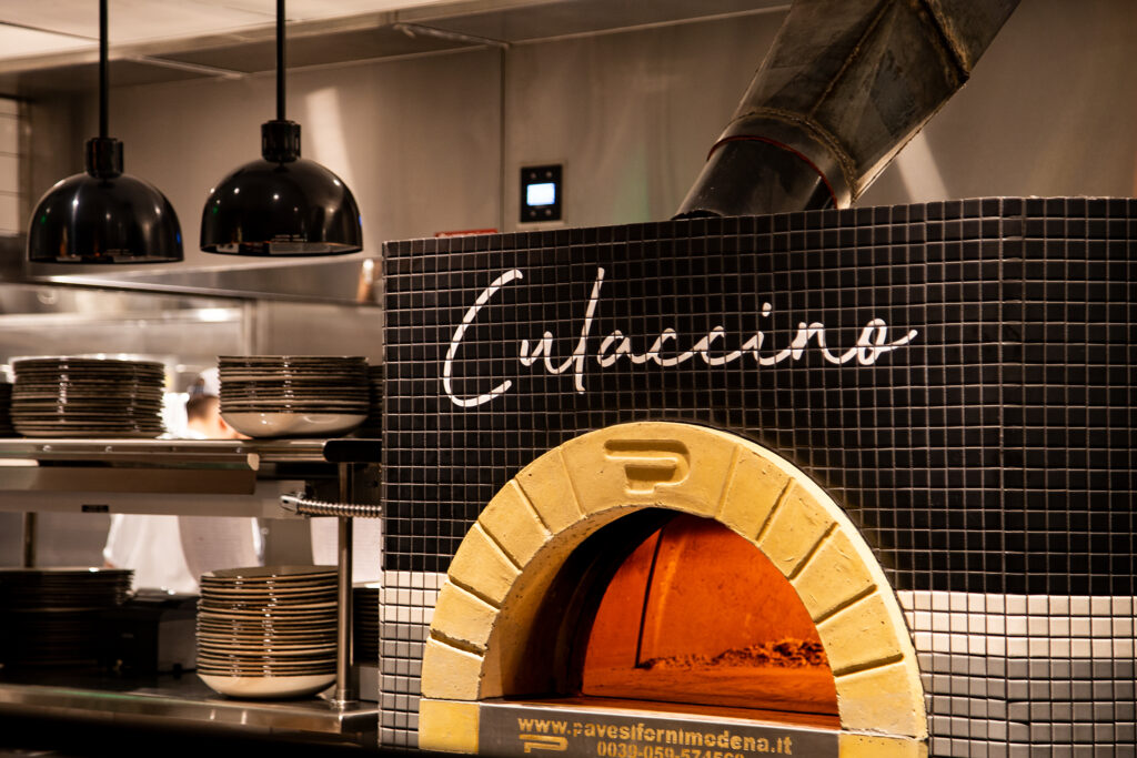 A black and white tiled pizza oven with 'Culaccino' written in cursive above it in Williamson County, Tennessee.