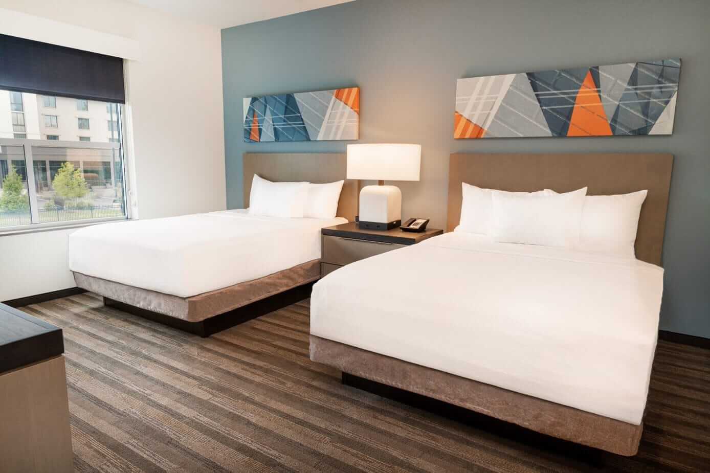 Hyatt House Franklin - Cool Springs A double queen bed at Hyatt House Franklin Cool Springs