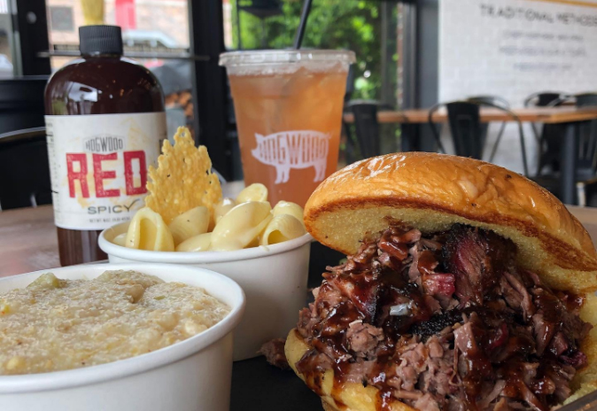 Communities A hearty meal featuring a pulled pork sandwich, macaroni and cheese, and grits with hot sauce in Williamson County, Tennessee.