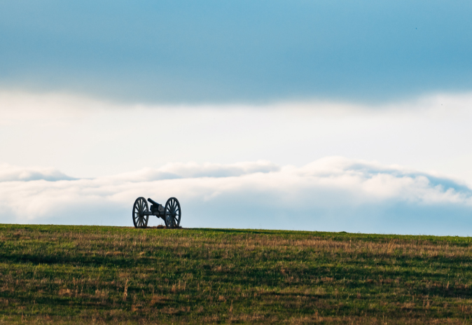 Communities A lone cannon rests on a grassy hill, silhouetted against a cloudy sky in Williamson County, Tennessee.