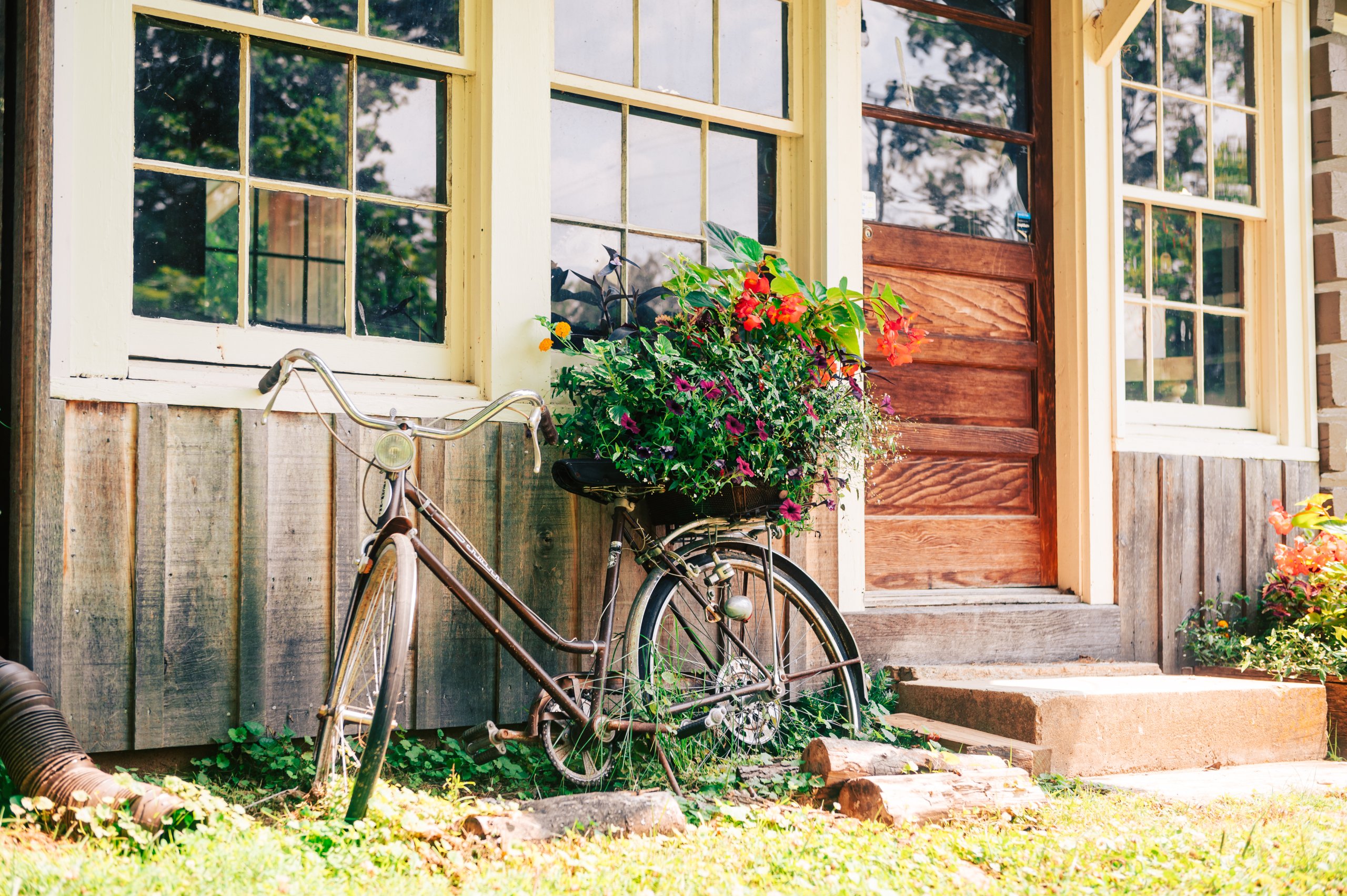 A vintage bike rests against the facade of cabin in Leipers Fork, Tennessee. 
