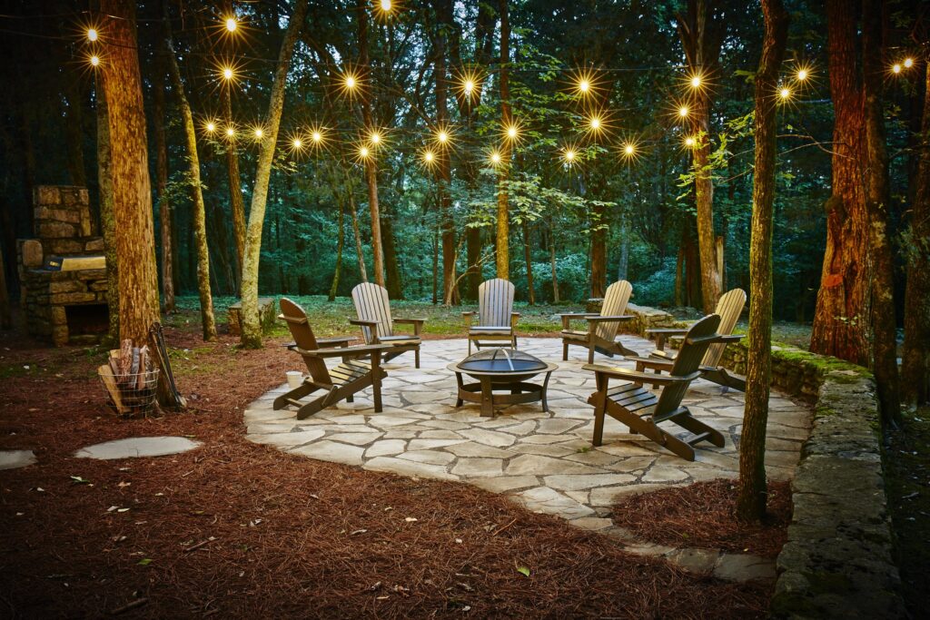 patio charis around a fireput at Cabin Creek Farm Rentals