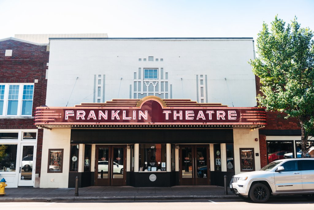 Discover 12 Fun Things To Do With Young Kids in Franklin, TN The Franklin Theatre, a historic movie theater with a distinctive Art Deco marquee, stands prominently on a street corner in Williamson County, Tennessee.