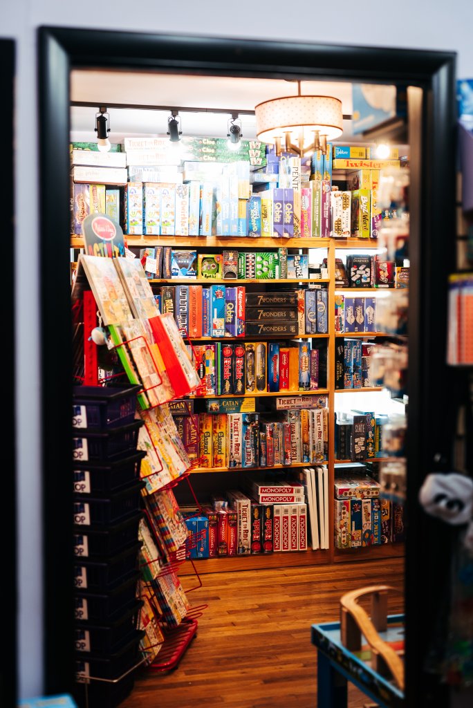 Discover 12 Fun Things To Do With Young Kids in Franklin, TN A vibrant game store filled with colorful board games and puzzles displayed on shelves and racks in Williamson County, Tennessee.