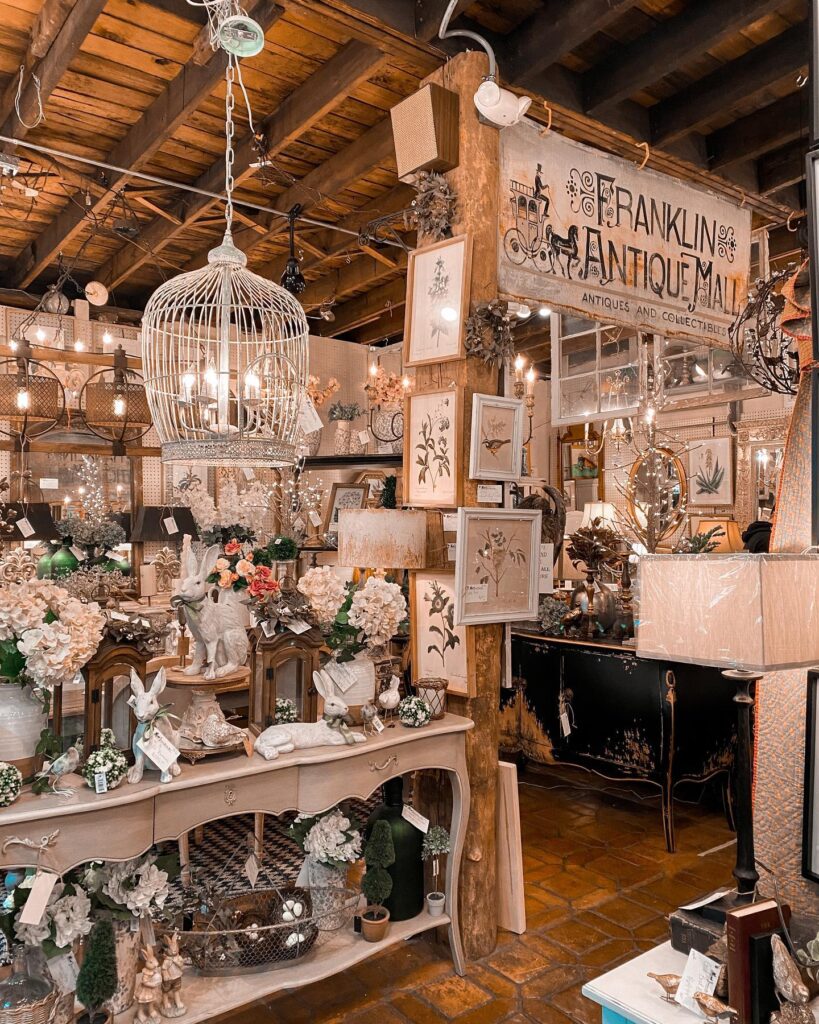 A charming antique store with a rustic aesthetic, featuring vintage decor and floral arrangements in Williamson County, Tennessee.