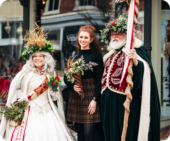 Dickens of a Christmas Three costumed individuals in festive attire pose together outdoors in Williamson County, Tennessee.