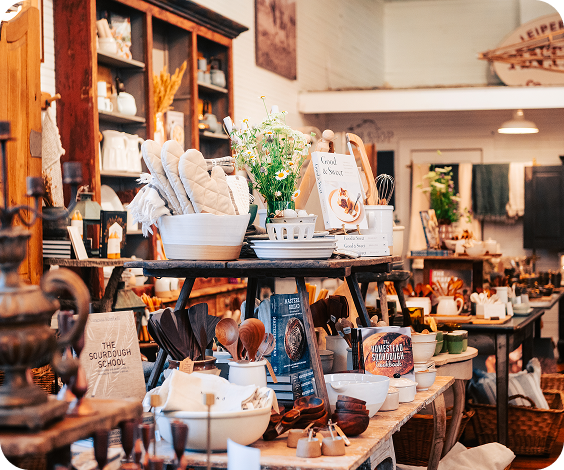 Dickens of a Christmas A cozy kitchen store filled with cooking utensils, books, and decorative items in Williamson County, Tennessee.