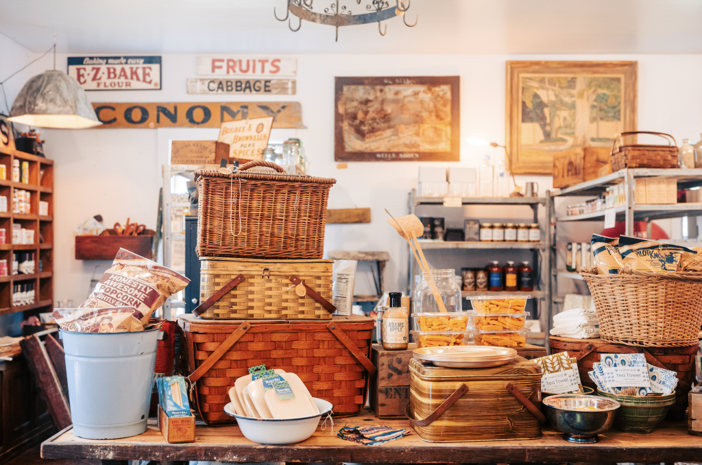12 Amazing Things to Do in Charming Leiper's Fork, Tennessee A rustic general store display with vintage baskets, jars, and food items in Williamson County, Tennessee.